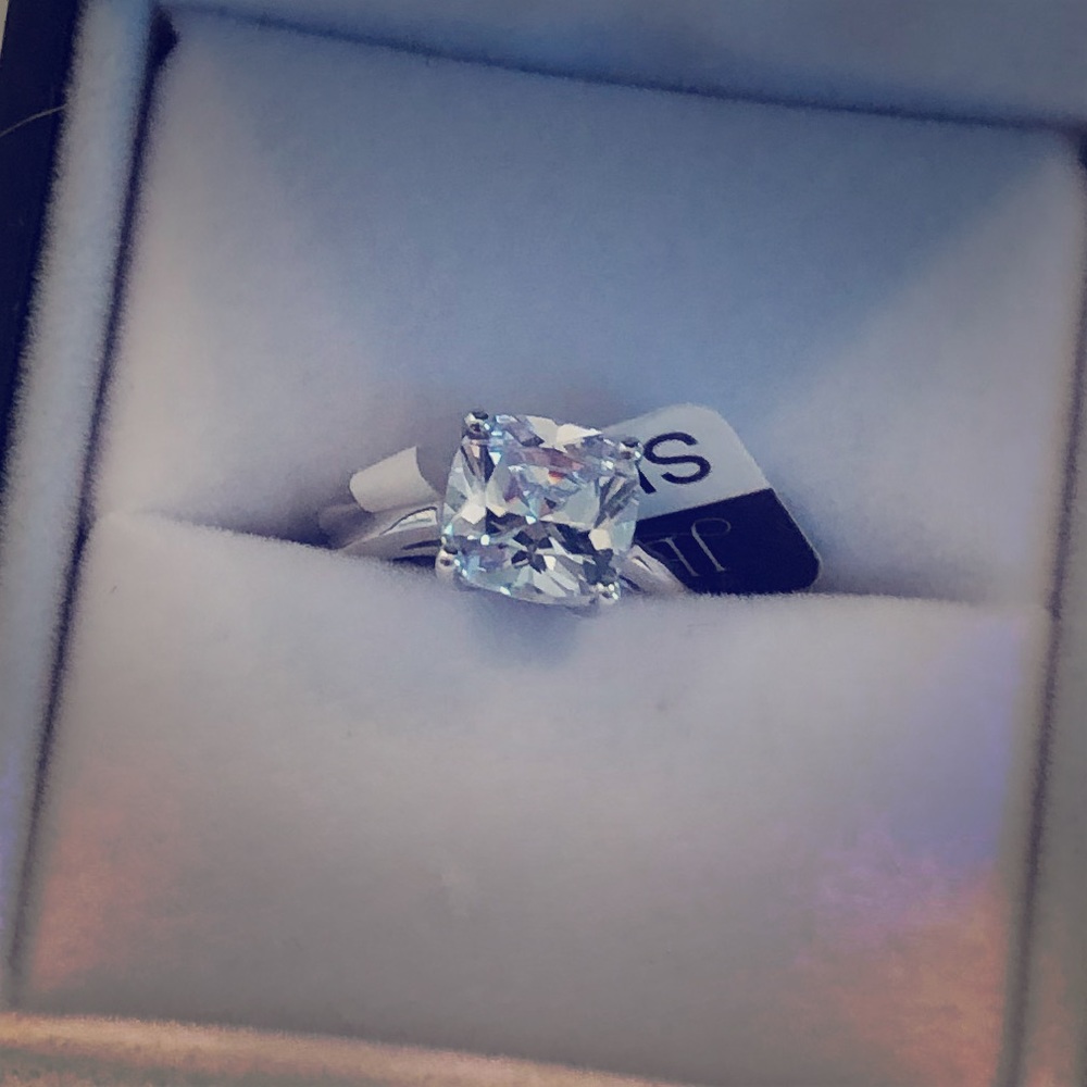 “Jeulia” White Sapphire solitaire ring.